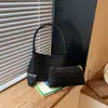 Bolso de diseño único para mujer, nuevo modelo 2026, bolso bandolera de un solo hombro para debajo del brazo, tacto de alta gama, bolso tote tejido de mano para mujer