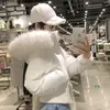 Chaqueta corta de algodón con capucha de piel sintética rosa para mujer, nuevo estilo de invierno, súper elegante, cintura ajustada, cuello grande de piel sintética, chaqueta de algodón versátil