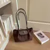 Bolso pequeño vintage de textura de alta calidad para mujer 2026 nuevo estilo moderno versátil de un solo hombro para llevar debajo del brazo bolso de mano para ir al trabajo