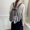 Mochila de menina passeio menina estudante fofa 2026 mochila escolar novo estilo coelho vento grande capacidade bolsa de ombro duplo orelhas de bolinhas
