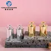Bomba dispensadora de oro de 20 dientes en stock, cabezal de bomba de loción plateado electrochapado, accesorios de plástico y materiales de embalaje