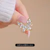 Broche de mariposa hueco con diamantes brillantes, pasador de seguridad anti-luz, decoración fija para cárdigan, bufanda