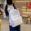 Mochila de comercio exterior para niñas de secundaria y universidad, lindo diseño de estrella, alto valor estético, modelo nuevo, mochila de gran capacidad para estudiantes de secundaria y preparatoria