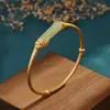 Pulsera de jade hetiano chapada en oro y plata esterlina S925, de talle alto, estilo retro, con hojas de bambú y abertura femenina adornada con circonitas.