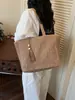 Bolso tejido de paja de gran capacidad para mujer, nuevo modelo 2026, versátil para ir al trabajo, bolso tejido de mano y al hombro, bolso de playa para vacaciones en la costa