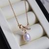 Colar com pingente de pérola de água doce em laço, estilo simples e elegante, da Suu Entry Luxury Niche, com corrente para clavícula, modelo versátil.