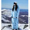 Conjunto de Macacão de Esqui à Prova de Vento e Resistente à Água com Forro de Fleece para Homens e Mulheres, Casaco com Capuz e Calça Quentes de Duas Peças para Uso Outdoor, Tamanho Grande