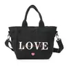 Bolsa de Lona Nueva Transfronteriza 2026 Bolso de Mano para Mujer Bolso para Almuerzo de Oficinista Bolso Tote Pequeño Bolso de Lona Versátil de Verano