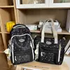 Mochila de novo estilo para meninas, na cor azul, com design estiloso, múltiplos compartimentos, adequada para alunos do ensino fundamental das séries 3-5, um conjunto de duas peças e o moderno estilo "pain bag".