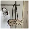 Comercio exterior transfronterizo minimalista con colgante de lunares 2026 terciopelo moda gran capacidad estilo coreano bandolera para el trabajo bajo el brazo para mujer