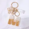 Llavero Colgante de Borla con Letra Inglesa Personalizada de Purpurina Blanca con Resina Epoxi y Colgante de Resina con Pan de Oro, Llavero Sencillo