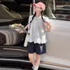 Conjunto de Blusa Estilo Boneca com Mangas Bufantes para Meninas Verão 2026 Novo Estilo Coreano Tendência Conjunto de Duas Peças com Shorts para Meninas Mais Velhas