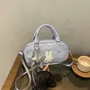Bolso de mano dulce de conejo estilo coreano inspirado en Ins, nuevo bolso de hombro y cruzado versátil y moderno para el trabajo para mujer