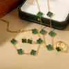 Set de Cuatro Piezas de Trébol de Cuatro Hojas de Doble Cara Más Vendido Transfronterizo: Collar, Aretes, Pulsera, Anillo, Conjunto de Joyería Versátil y Elegante de Cinco Hojas