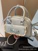 Bolso Cuadrado Pequeño de Mano Simple Elegante 2025 Nuevo Estilo Coreano Moderno de Alta Gama Bolso de Hombro Moderno Combinable Bolso Bandolera