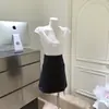 Falda Corta Versátil de Cintura Alta para Oficina Primavera Verano Color Sólido Algodón Tejido Directo de Fábrica con Etiquetas