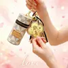 Pingente de bolsa de celular da sorte trevo de quatro folhas dourado, chaveiro de ouro maciço, pingente de bolsa para batom, pequeno presente promocional para o Festival Qixi