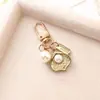 Llavero de Perlas Pequeñas Frescas Simple Hecho en Fábrica Pulsera de Perlas con Cinta Creativa Colgante para Bolso Coche