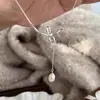 Collar de Perlas con Lazo de Diseño Nicho de Lujo Ligero Retro Francés para Mujer, Cadena Versátil de Clavícula de Gama Alta