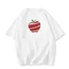 Camiseta negra de manga corta de seda de leche con estampado de manzana roja, nuevo estilo de verano, diseño americano holgado, top versátil de nicho