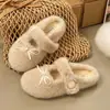 Chinelos de Pelúcia Casuais Fofos Chinelos de Algodão Estilo Francês INS para Mulheres Veludo Extra Quente Laço Novo Estilo Inverno Versão Coreana 2026