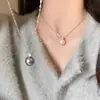 Collar de perla única de la Princesa Diana para mujer, cadena para la clavícula de diseño de nicho de lujo ligero, cadena para suéter de alta calidad