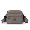 2026 Nova Bolsa Feminina de Cor Sólida Tendência Moda Cor Sólida Ombro Único Transversal Simples Bolsa Feminina de Nylon Casual Pequena Quadrada