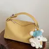 Bolso de mano de alta costura estilo coreano, bolso de hombro, nuevo modelo primavera 2026, bolso tipo almohada casual simple, bolso cruzado de nicho para mujer