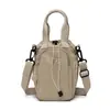 Bolsa para teléfono móvil de mujer 2026 nuevo estilo casual japonesa y coreana bolsa tipo cubo gran capacidad un solo hombro bandolera cordón mochila pequeña