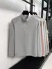 Producto principal Otoño/Invierno 2026: Top casual simple para hombre, camiseta con media cremallera, prenda interior deportiva casual de color liso, disponible para venta al por mayor