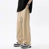 Pantalones casuales de color liso estilo japonés para hombre, pantalones rectos holgados para primavera y otoño, pantalones cargo de pierna ancha fluidos versátiles con cintura elástica