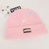 Gorro de tricô em mistura de lã estilo coreano inspirado na dopamina com laço, projetado para mulheres, proporcionando calor e proteção para as orelhas no outono e inverno, adequado para estudantes