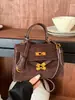 Bolsa de mão de design minimalista de nicho transfronteiriça, bolsa quadrada pequena da moda feminina, bolsa tira-colo para o dia a dia Kelly