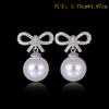 Aretes de Perlas Estilo Corto para Mujer Perla Lazo Incrustado Dulce y Lindo Estilo Coreano Venta Directa de Fábrica Aretes de Aguja de Plata Esterlina S925