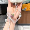 Cadena para Teléfono de Fresa de Cristal Iridiscente con Lazo de Pedrería Brillante, Correa de Muñeca Antiperdida, Llavero Encanto de Bolsa Femenino