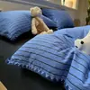 Nuevo conjunto de cuatro piezas de gasa con rayas de lujo ligero, estilo ins, puntada de triángulo simple, borde de concha, funda de edredón de algodón puro para dormitorio, juego de 3 piezas