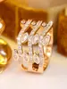 Anillo ancho de oro multicapa hueco transfronterizo con circón marquise de lujo ligero e incrustación de diamantes entrelazados