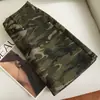 Falda corta de mezclilla camuflaje estilo americano para mujer, nueva primavera/otoño 2026 cintura alta línea A corte ajustado ropa de trabajo falda sexy