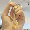 Suministro Directo de Fábrica Acrílico Transparente Artificial Sueño Luminoso Caracola DIY Pareja Puesto de Coche Llavero Al por Mayor