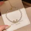 Pulsera de perlas con lazo de doble capa estilo vintage francés, diseño único y versátil, joyería de lujo ligero y de alta gama