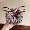 Goma para el pelo de malla con lazo de corazón color marrón claro estilo Dongdaemun coreano, nuevo modelo 2026 con un toque de alta gama para peinados de coleta