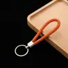 Chaveiro de corda de couro pingente de carro acessórios corda de chave de corda de couro trançado pu para empurrar pequenos presentes fabricantes atacado