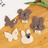 En Stock Atmósfera Otoño e Invierno Color Té con Leche Conejo Oso Mariposa Pendientes DIY Accesorios para el Cabello Accesorios Materiales