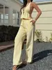 2025 Nuevo Conjunto de Moda Transfronteriza Europea y Americana para Mujer con Cinturón, Top Delgado sin Mangas de Cuello Halter y Pantalones Cortos Elegantes en Amarillo
