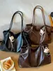Bolso tote minimalista de nicho Shuai Mi Jia para mujer, nuevo modelo otoño 2026, de gran capacidad, casual, para ir al trabajo, de hombro y debajo del brazo