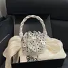 Nuevo y exquisito bolso cubo de moda para principios de otoño de 2026, de alto valor estético, adecuado para el trabajo y los desplazamientos, bolso de hombro elegante y único, bolso cruzado