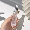 En Stock Al Por Mayor Botella de Vidrio con Relieve para Spray de 12ml Botella de Relleno de Perfume Tapa de Aluminio Portátil Botella Vacía de Niebla Fina 10ml