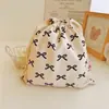 Bolsa de tecido de algodão com cordão e estampa de laço bolsa de armazenamento para viagem classificação doméstica bolsa de algodão atacado