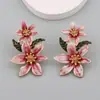 Estilo nacional nueva moda personalidad creativa hermosos pendientes de aleación con gota de aceite de flor pendientes de aceite de flor todo partido pendientes al por mayor