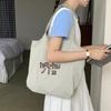 Bolsa de Relaxamento Preguiçoso 2025 Nova Deslocamento Diário Casual Combina com Tudo Estudante Lona Única Letras Bolsa Tote
